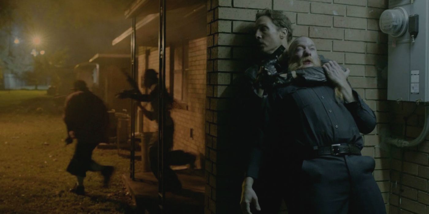 Cohle holds a man by the throat from True Detective 