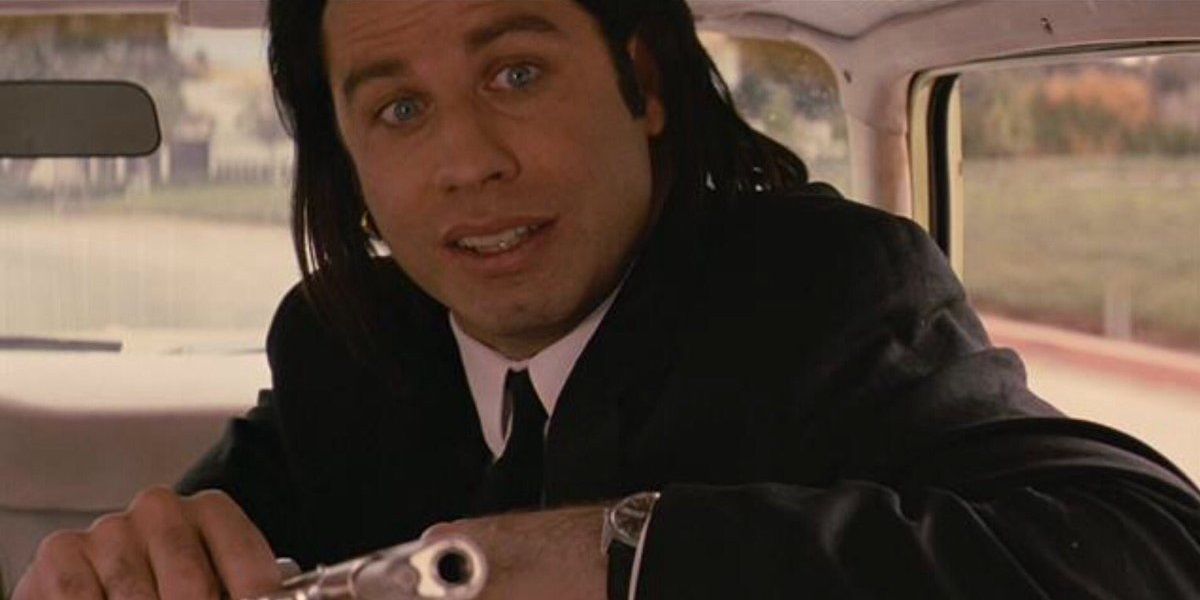 Vincent riding in the car with his gun in Pulp Fiction