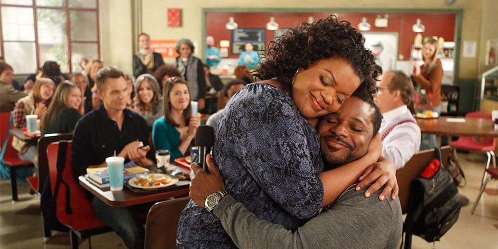 Shirley and Andre embracing in Community