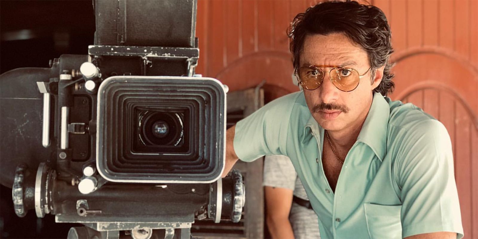 Zach Braff with a mustache directing