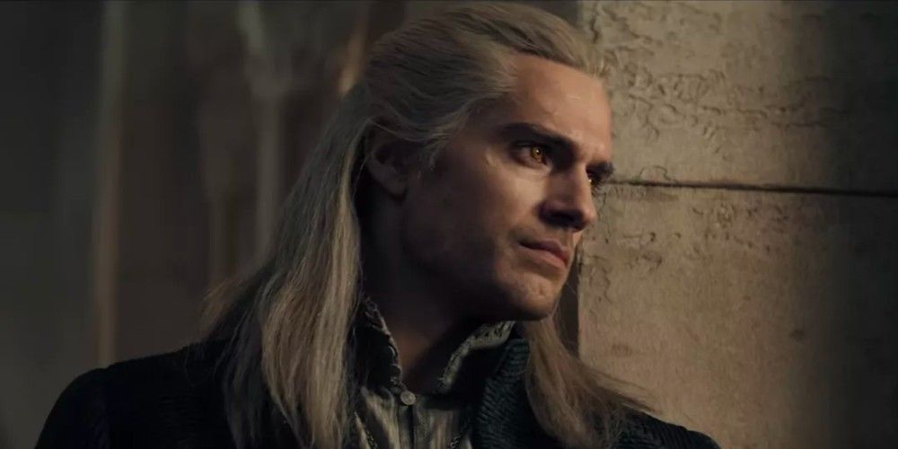 Geralt of Rivia with a feeble smile in The Witcher