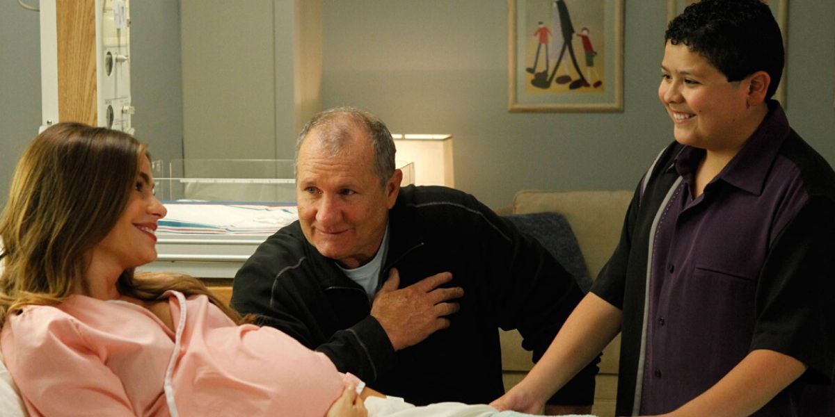 Jay and Manny at Gloria's bedside in Modern Family