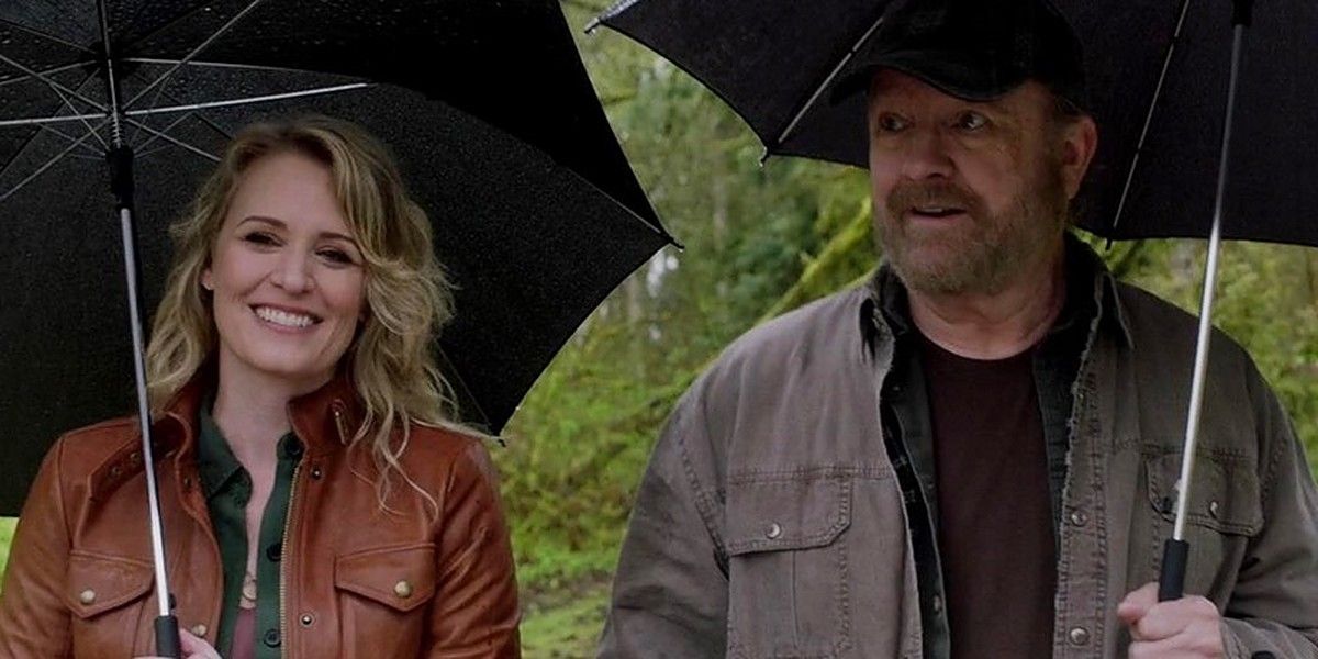 Mary and Alternate World Bobby out a walk in the rain in Supernatural