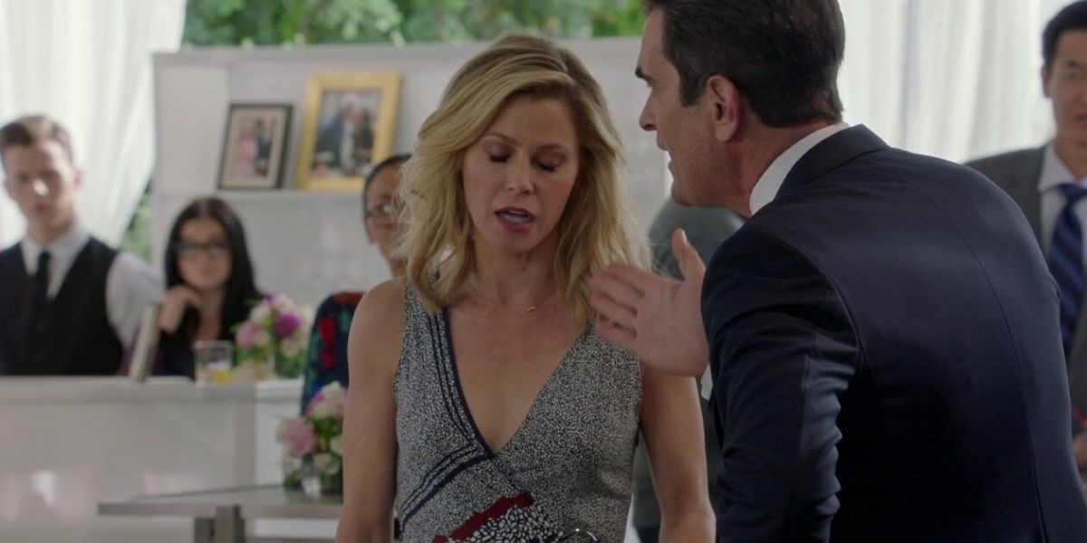 Claire and Phil argue at a wedding on Modern Family