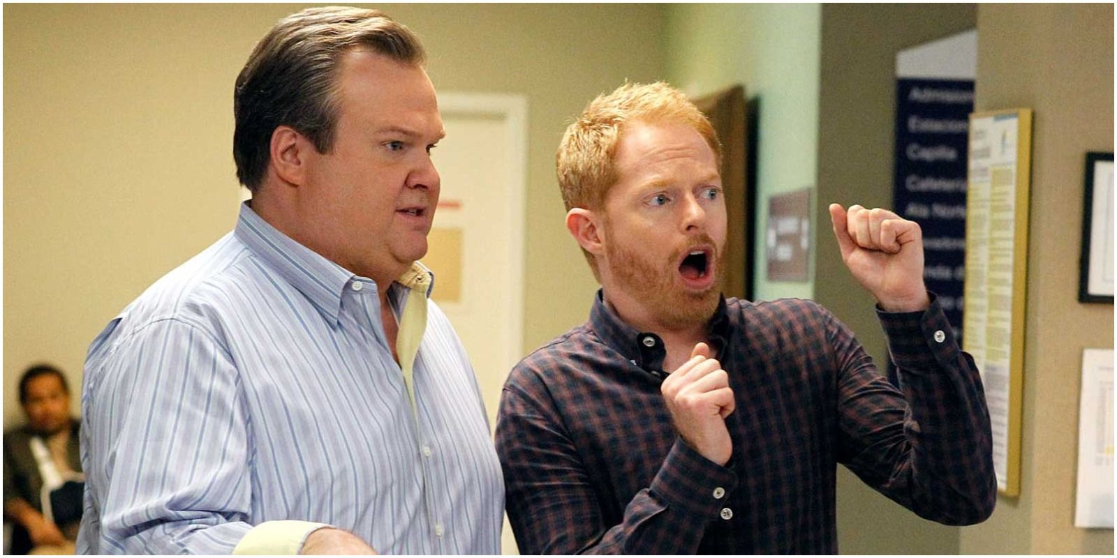 Cam and Mitchell looking surprised in Modern Family