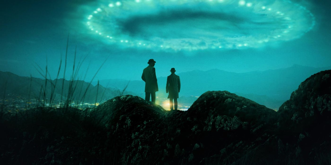 Two characters stand on a hill before a massive blue light in the sky