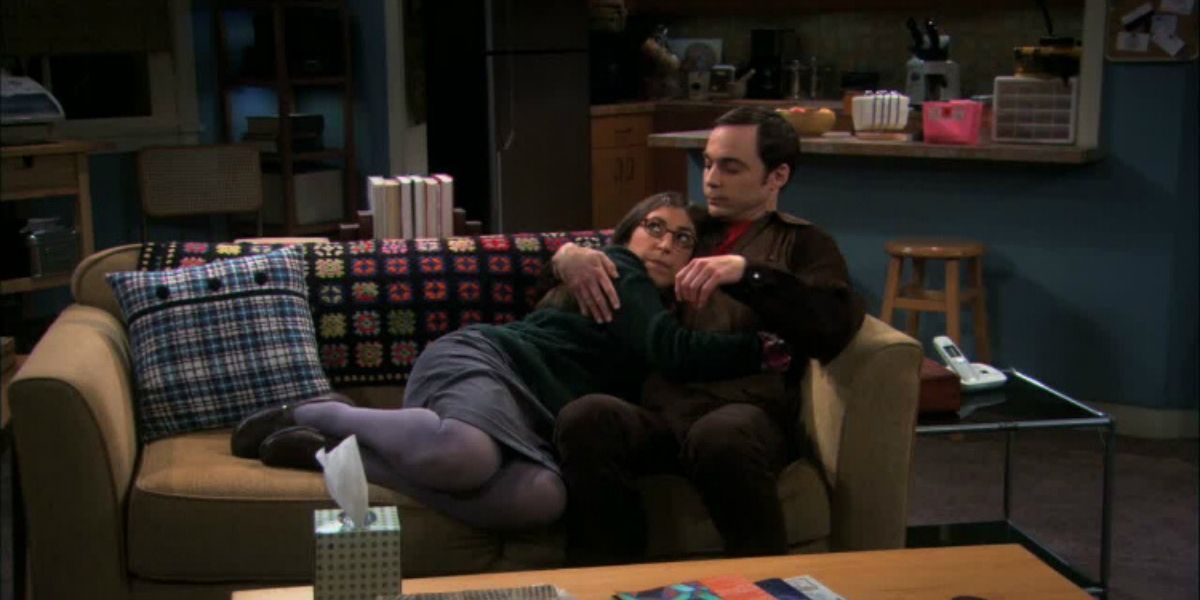 Sheldon and Amy hug on the couch on TBBT