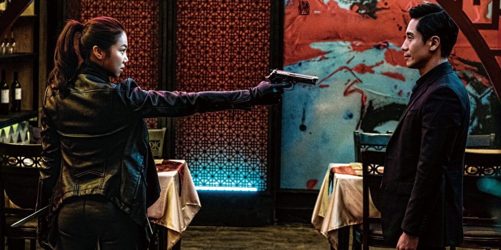 Yeon-soo points a gun at Joong-sang in the finale of The Villainess
