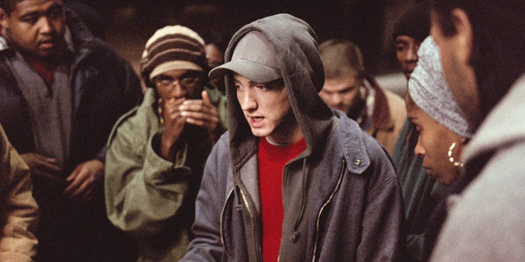 Eminem Marshall Bruce Mathers rapping in 8 Mile with a group of people.