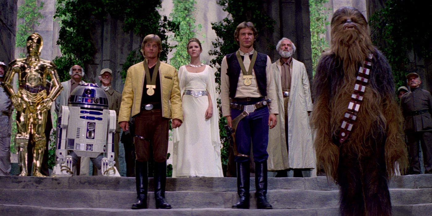 C-3PO, R2-D2, Luke Skywalker, Princess Leia, Han Solo, and Chewbacca stand at the medal ceremony at the end of A New Hope