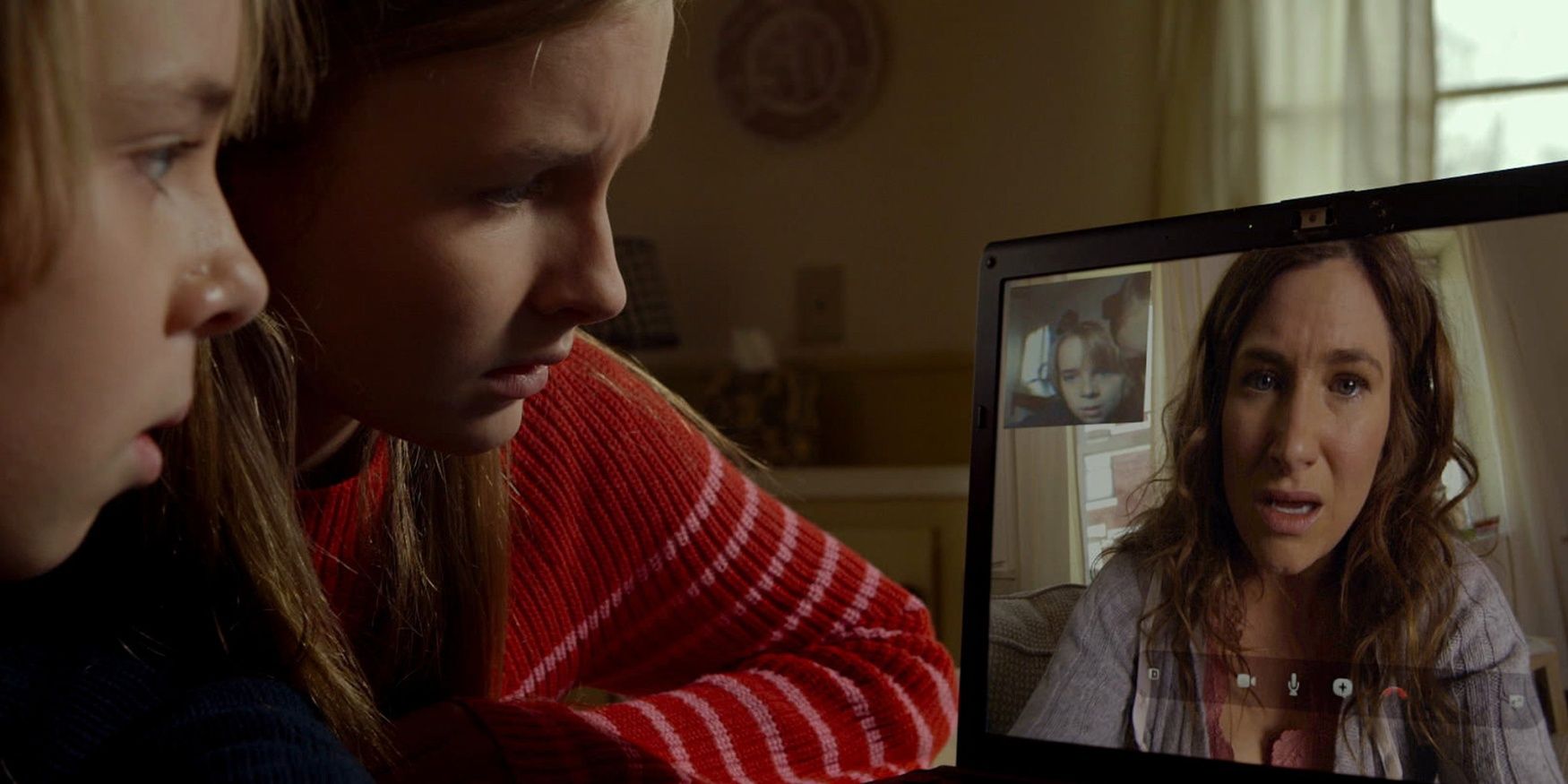 The children speaking to their mother over video call in The Visit.