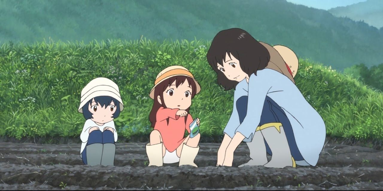 A mother digging the soil next to two kids in Wolf Children.