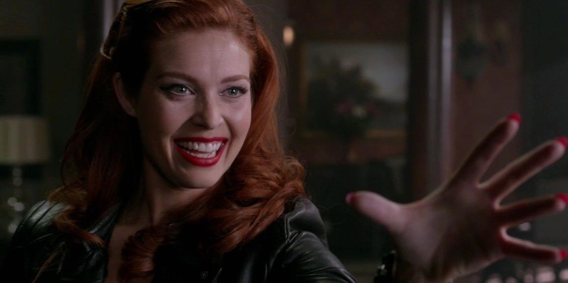 Abaddon smiles while holding her hand out to use her power in Supernatural