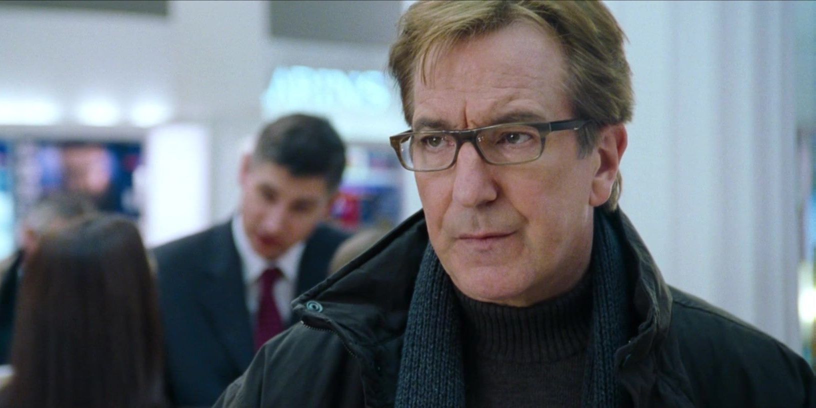 Alan Rickman looking frustrated in Love Actually.