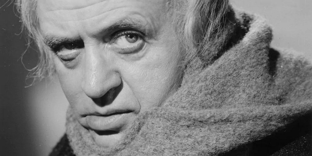 Alistair sim as Scrooge in close up in black and white