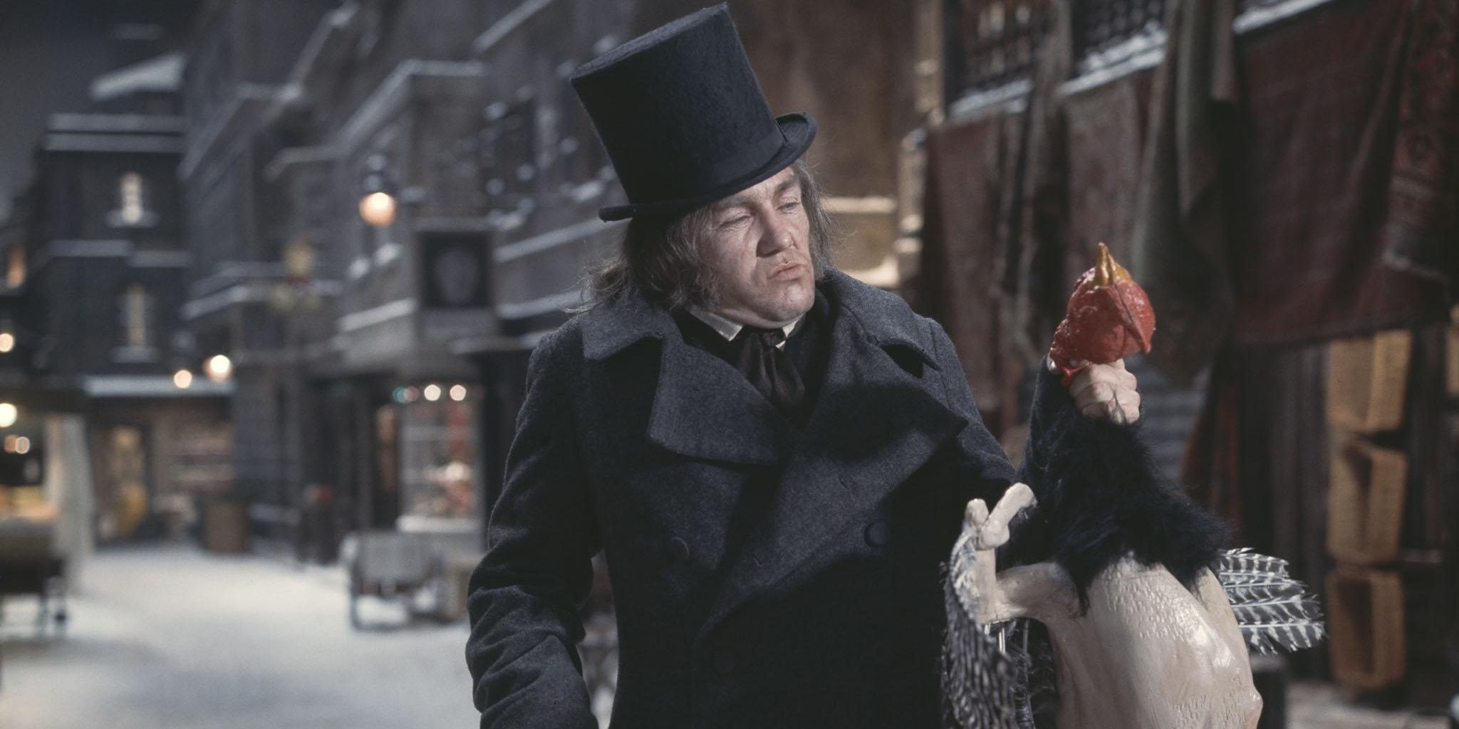 Albert Finney in Scrooge holding the Christmas goose by a neck