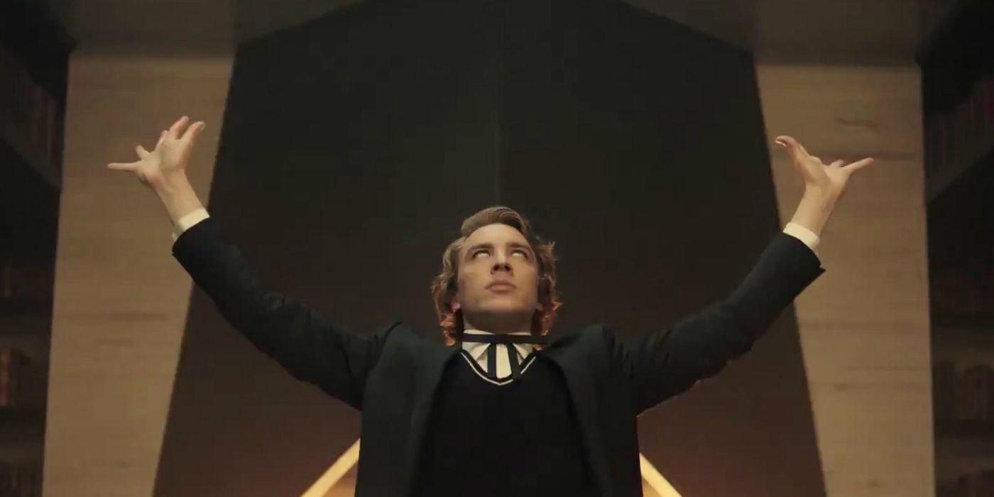 Cody Fern as Michael Langdon with his arms towards the sky and his eyes rolled to the back of his head