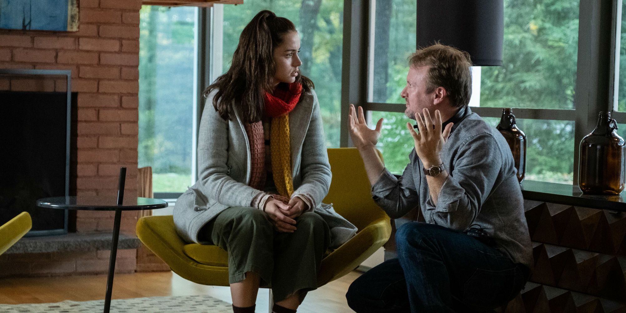 Ana de Armas and Rian Johnson on the set of Knives Out