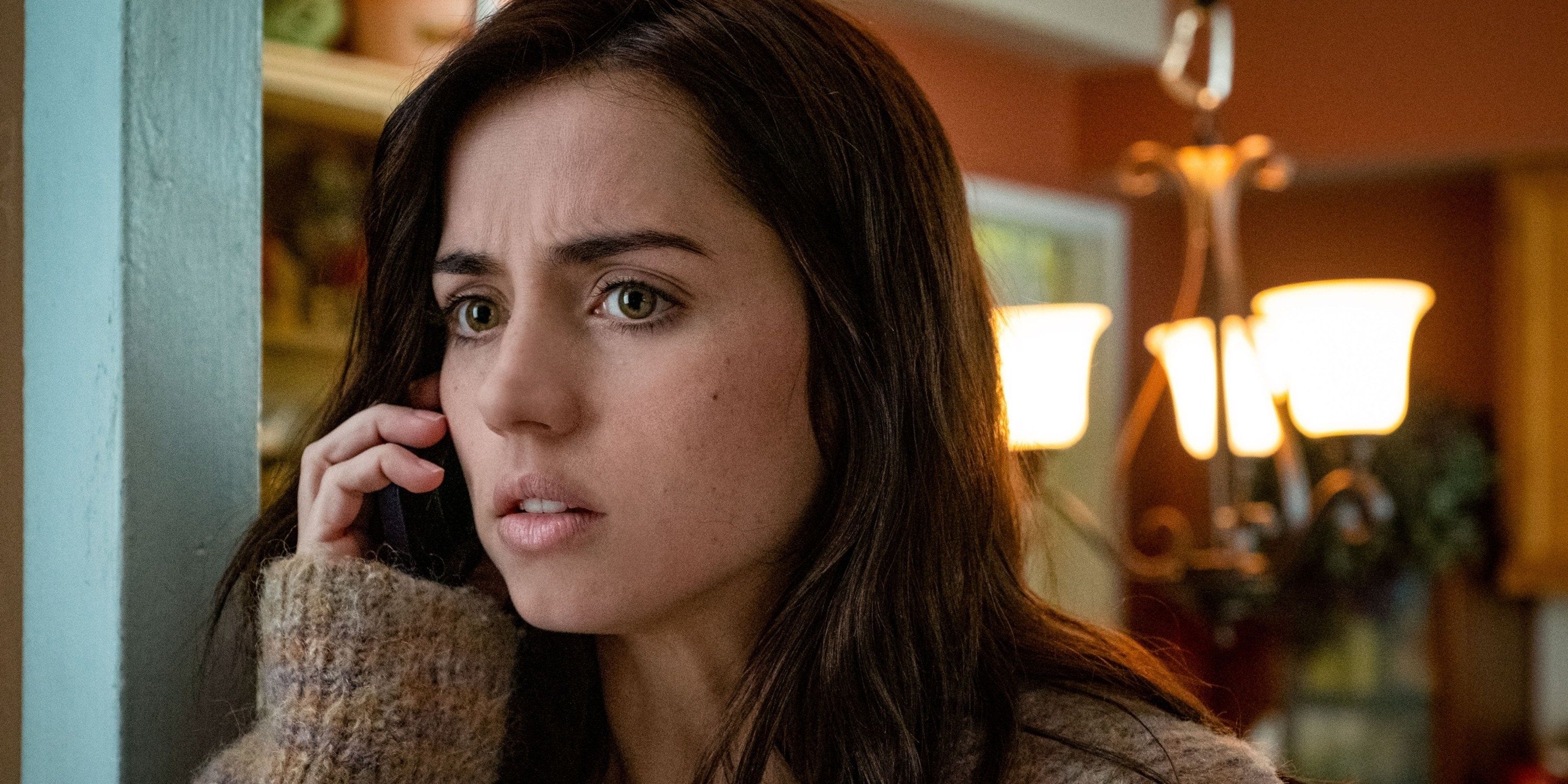 Ana de Armas on the phone looking concerned in Knives Out