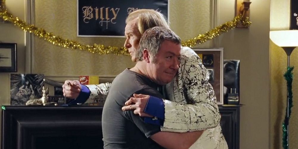 Billy Mack and Joe hug in Love Actually