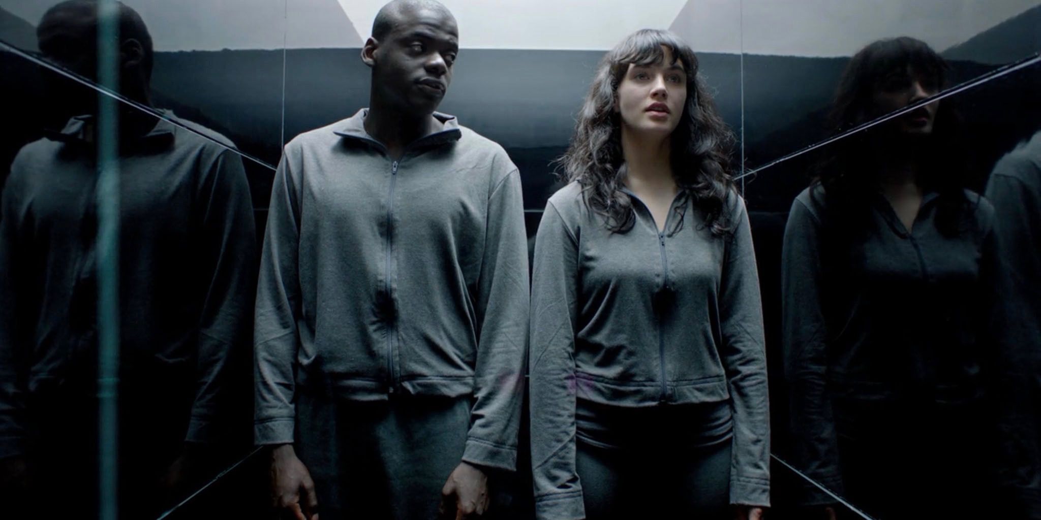Bing and Abi standing together in Black Mirror's 'Fifteen Million Merits.'