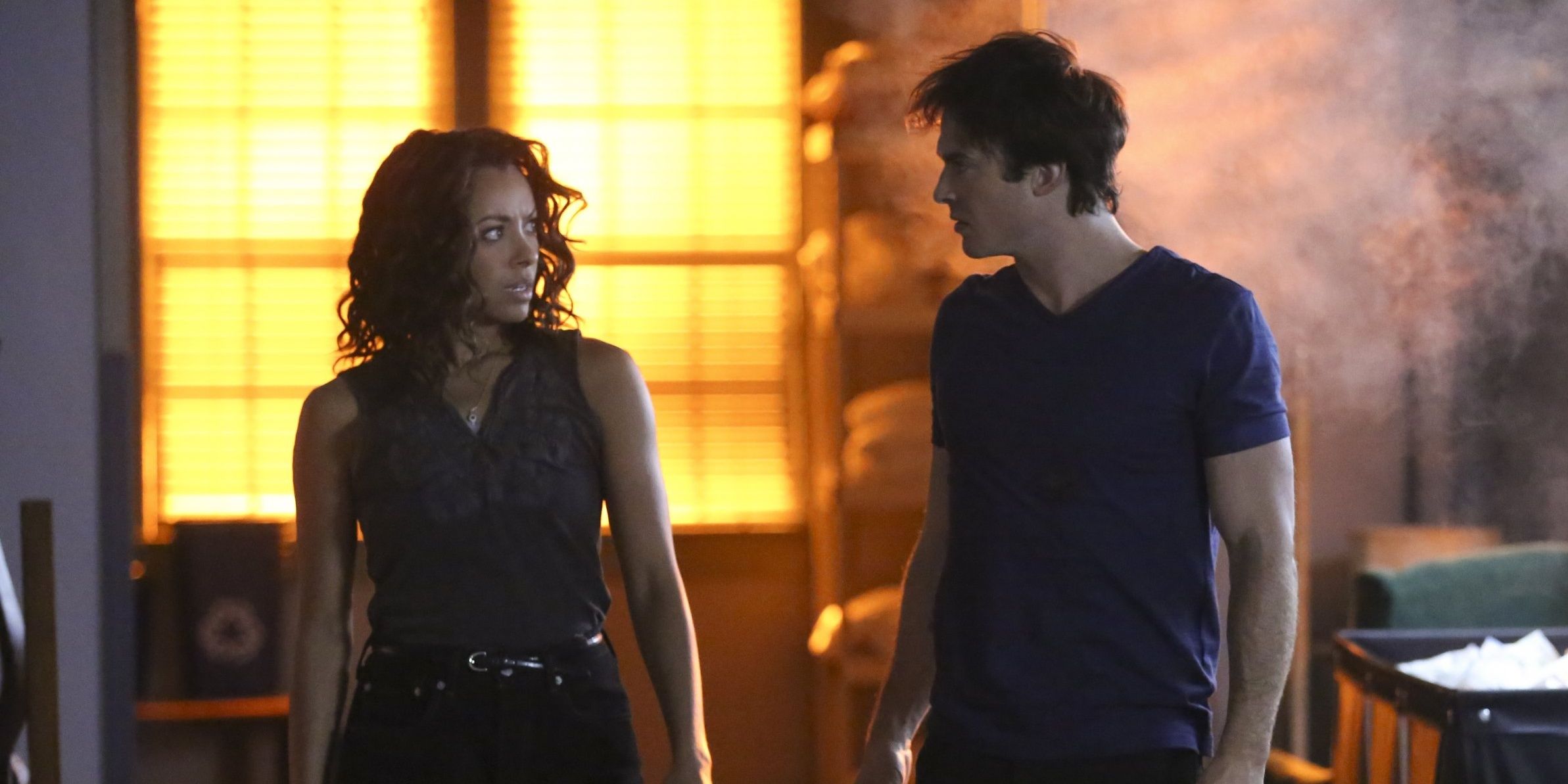 Bonnie and Damon walking next to each other in The Vampire Diaries.