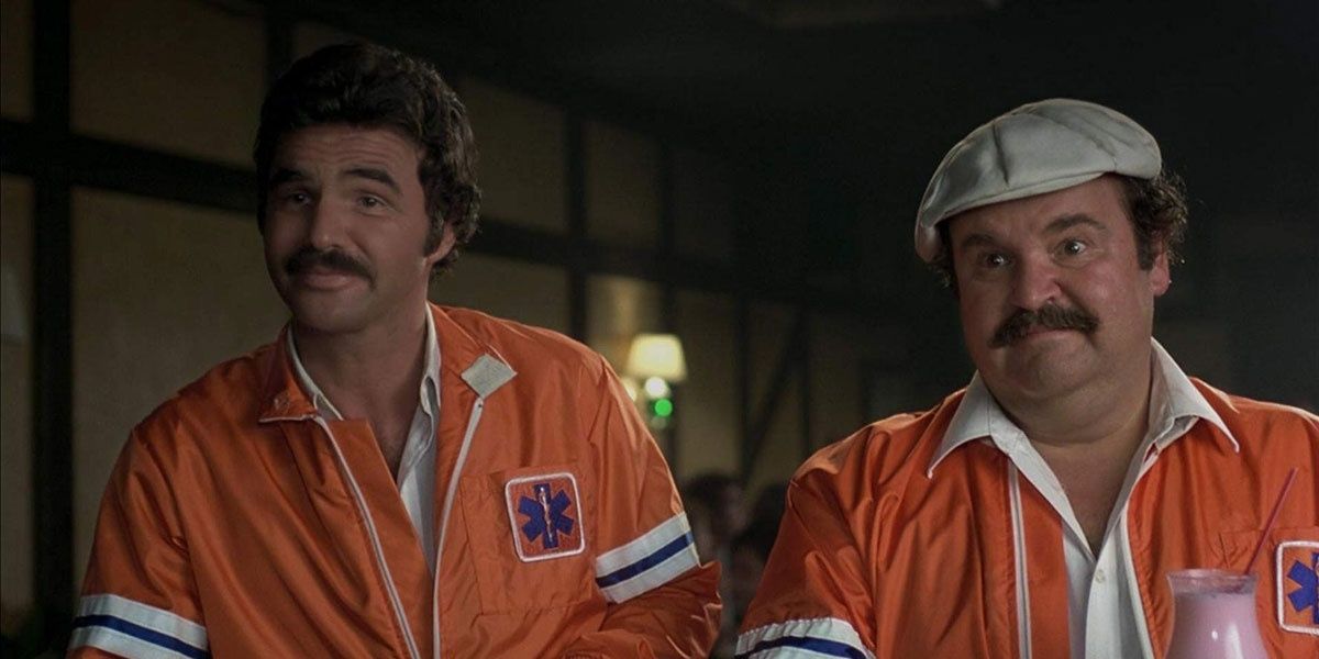 Two men in racing uniforms in The Cannonball Run.