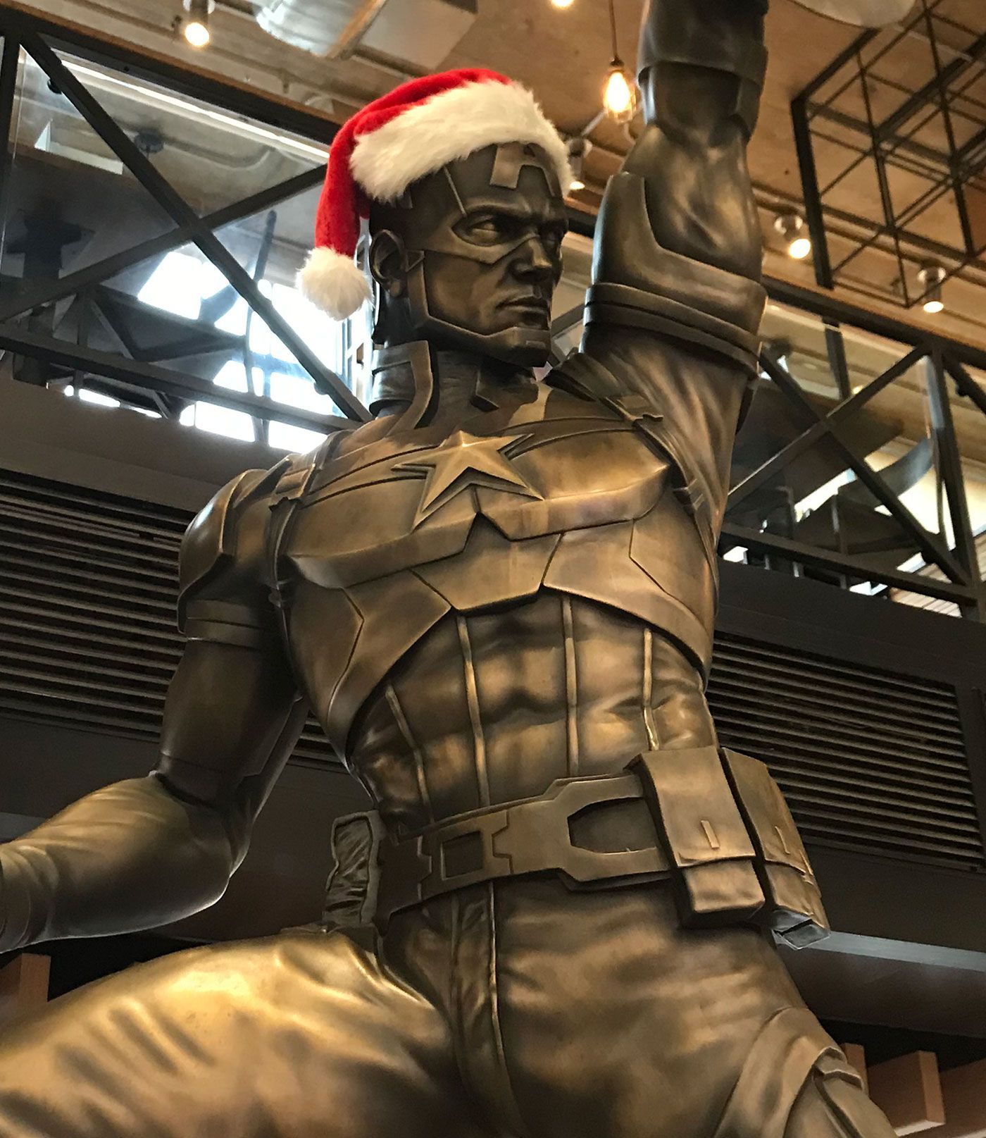 Captain America statue in a Christmas Santa hat photo by Andrew Duncan