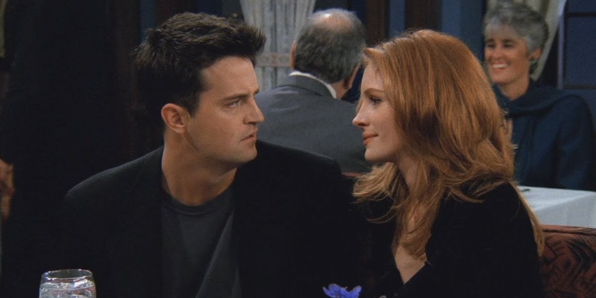 Chandler Bing and Susie Moss in a restaurant on Friends.