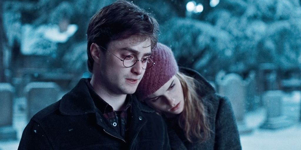 Harry and Hermione standing together in Godric's Hollow in Harry Potter and the Deathly Hallows Part 1.