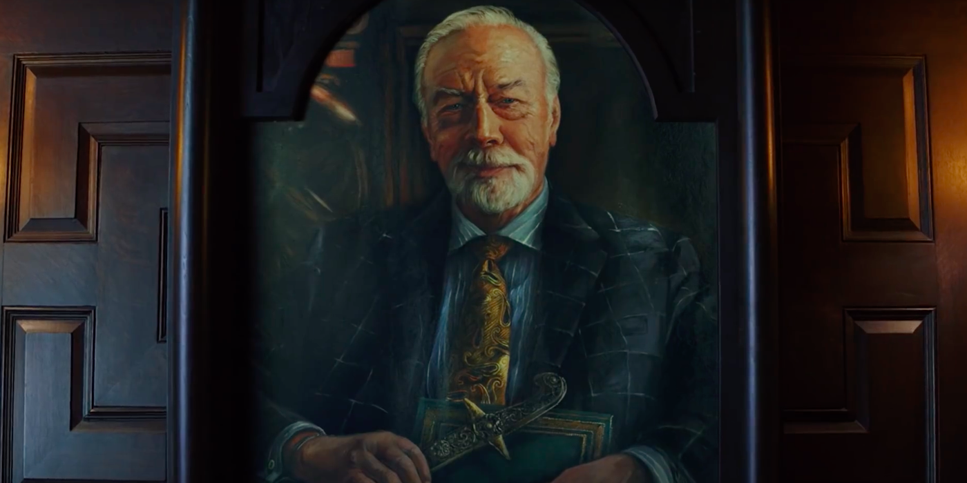 The portrait of Harlan Thrombey smiling in Knives Out