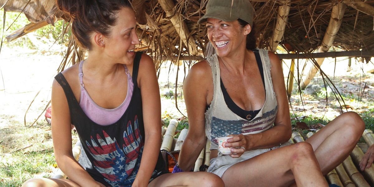 Ciera and Laura sit in their shelter on Survivor: Blood vs. Water