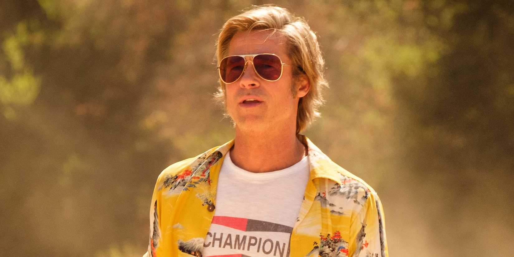 Brad Pitt as Cliff Booth standing in the dust in Once Upon A Time In Hollywood