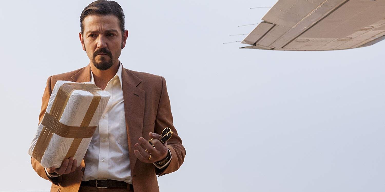Felix steps out of a plane with a brick of cocaine in Narcos Mexico 