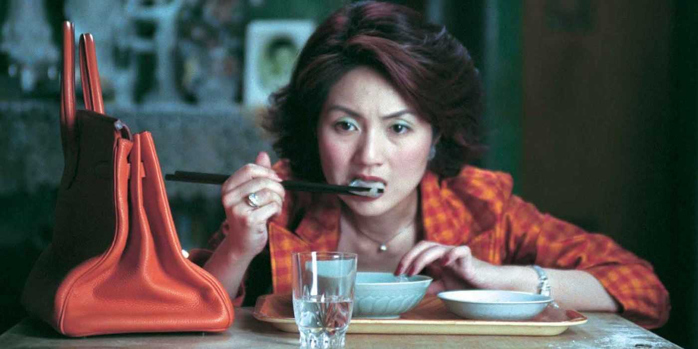 A woman eating in a restaurant in Dumplings (2004)