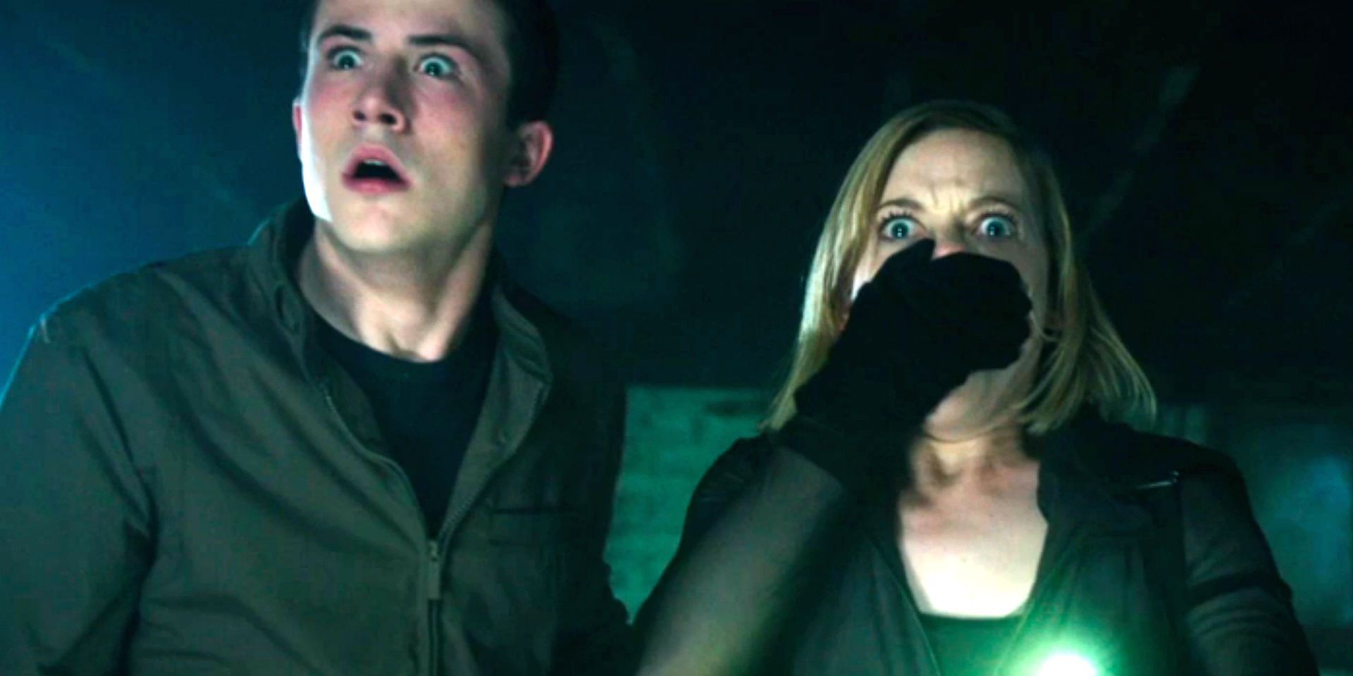 Dylan Minnette and Jane Levy looking at something in shock in Don't Breathe