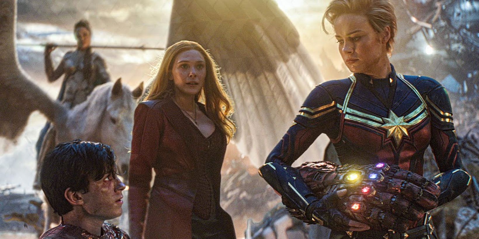 Valkyrie, Wanda Maximoff, and Carlo Danvers surround Peter Parker to protect the Infinity Gauntlet in Avengers: Endgame