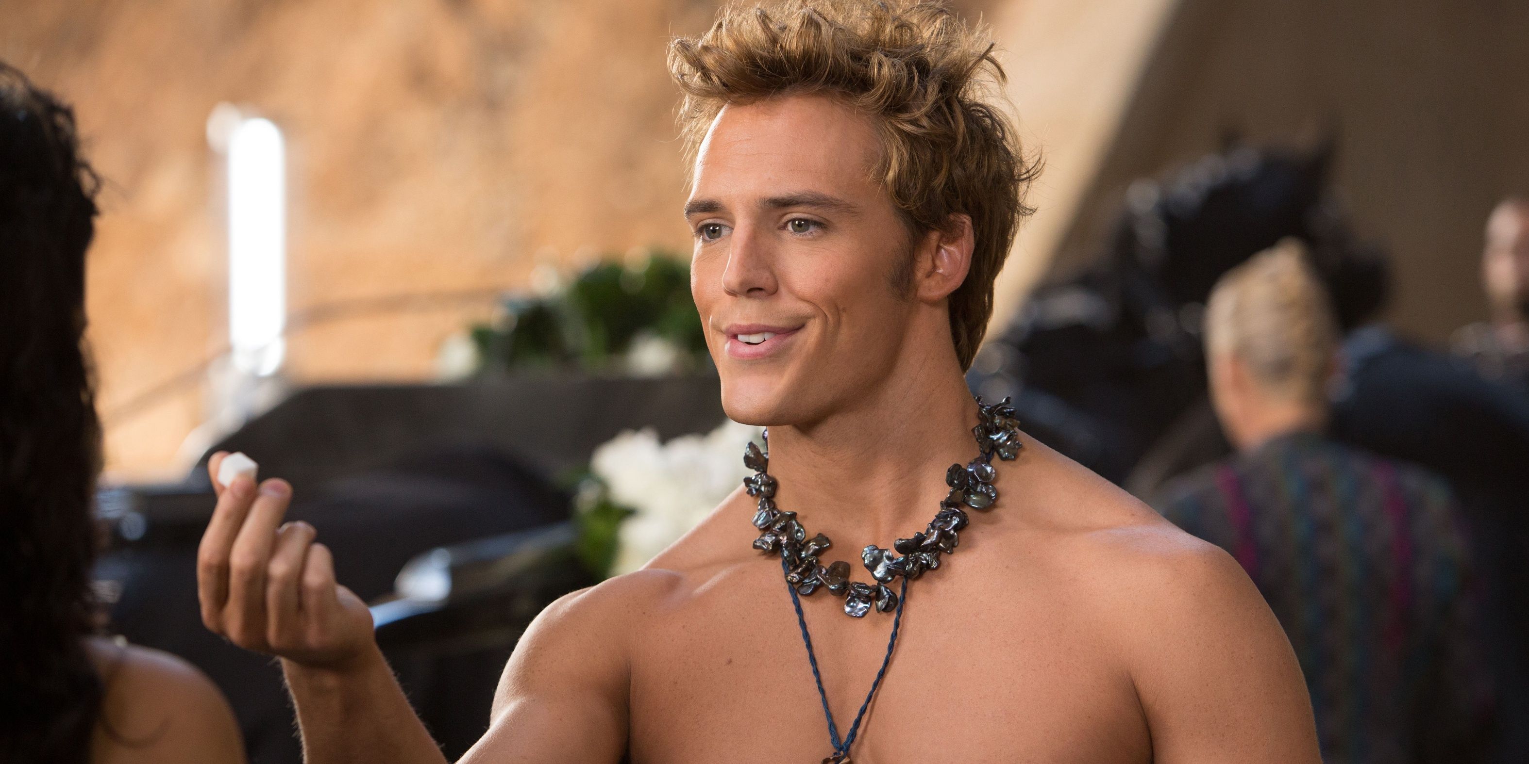 Finnick offering a sugar cube in The Hunger Games: Catching Fire.