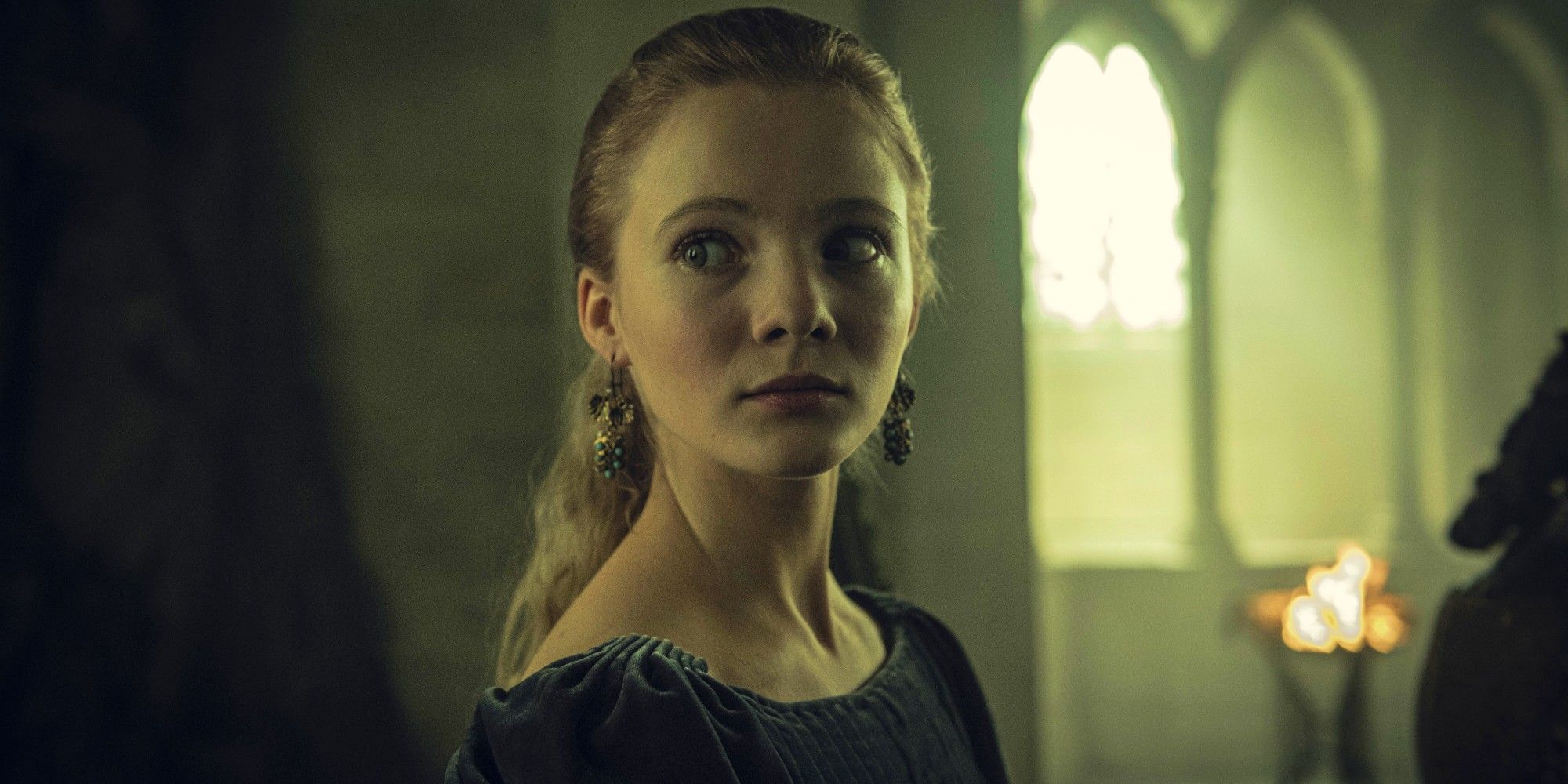 Freya Allan as Ciri looking worried in The Witcher
