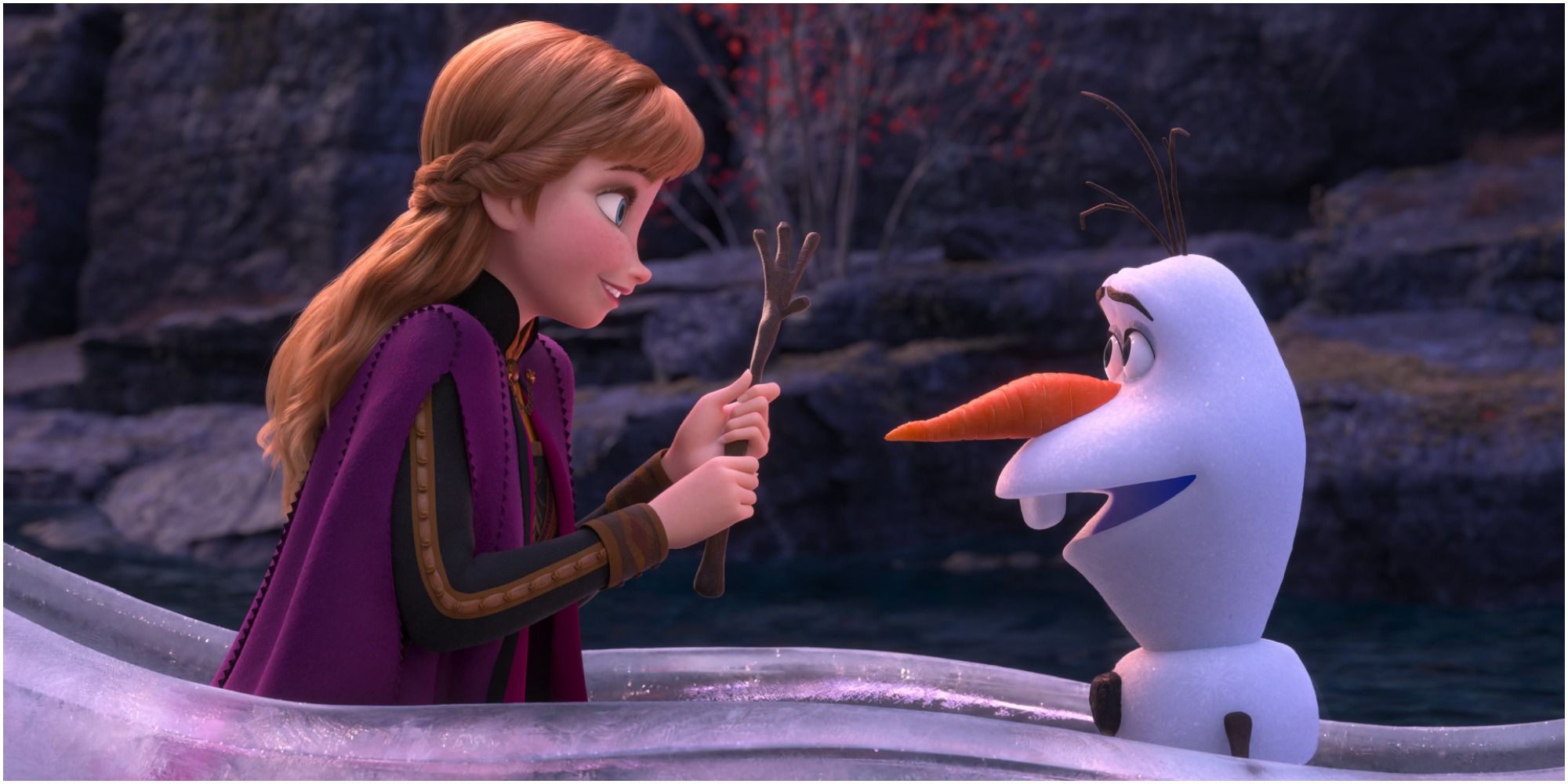 Anna and Olaf riding together in an ice boat from Frozen 2