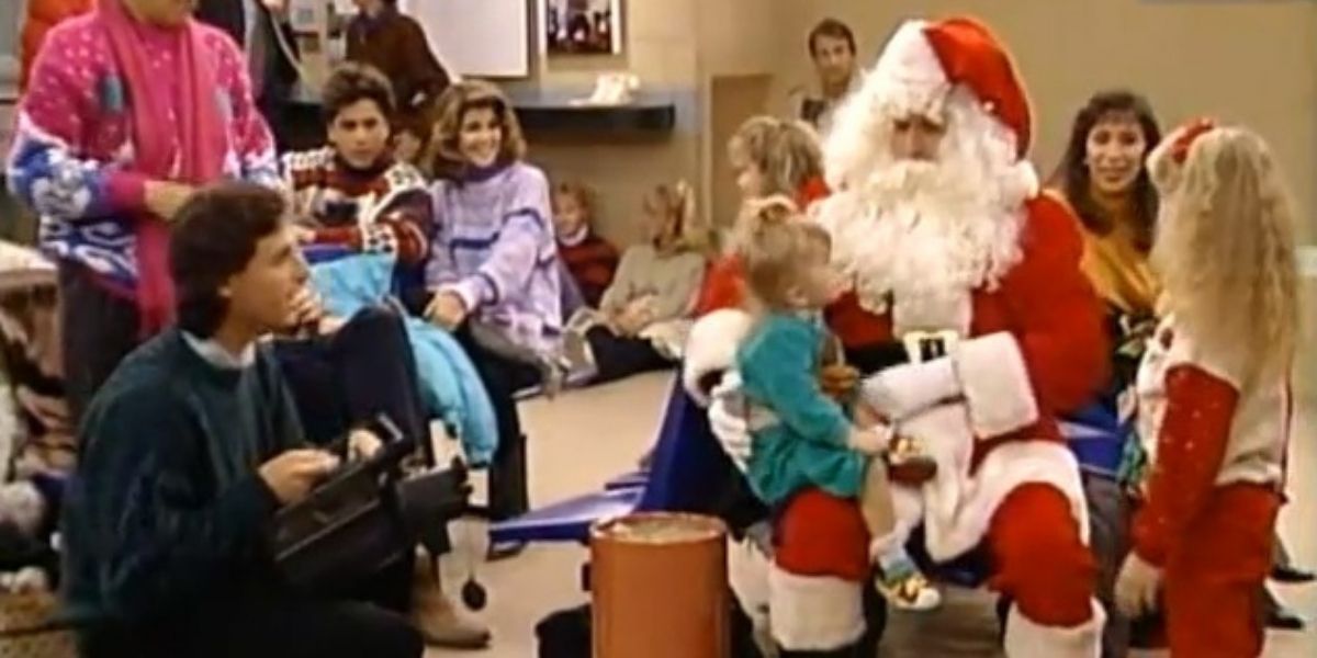 Michelle sitting on Santa Joey's lap at the airport terminal in Full House