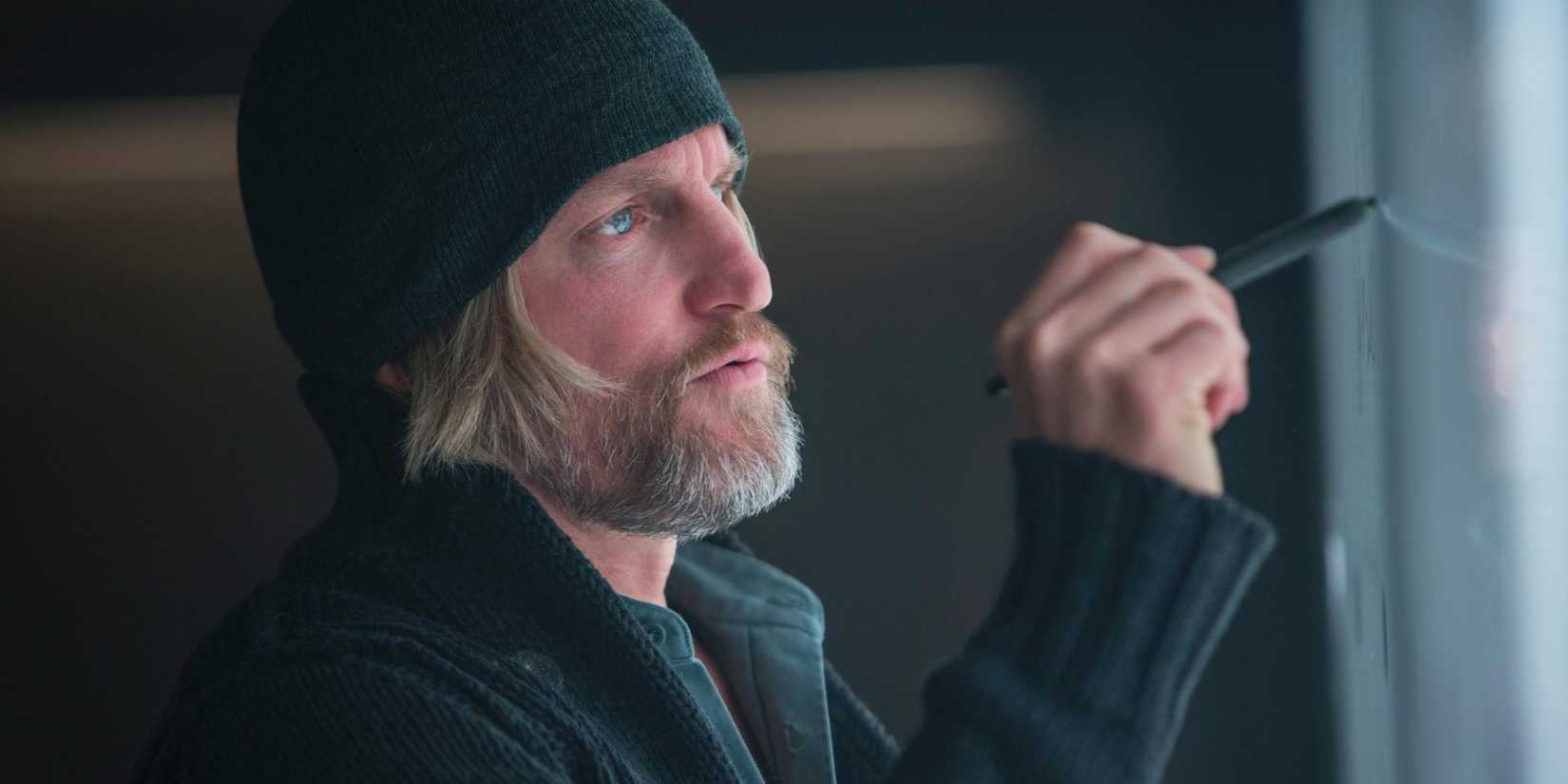 Haymitch writing on a board in Mockingjay