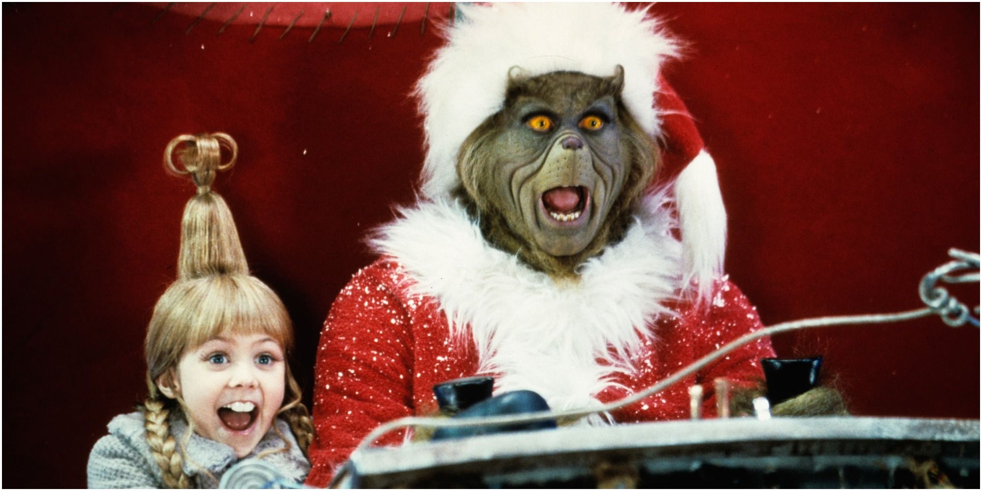 Grinch and Cindy Lou on a sleigh in How the Grinch Stole Christmas