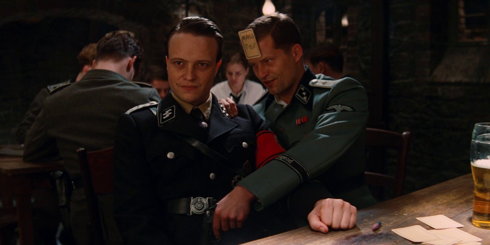 Hugo Stiglitz aims his pistol at a German officer's crotch in Inglourious Basterds