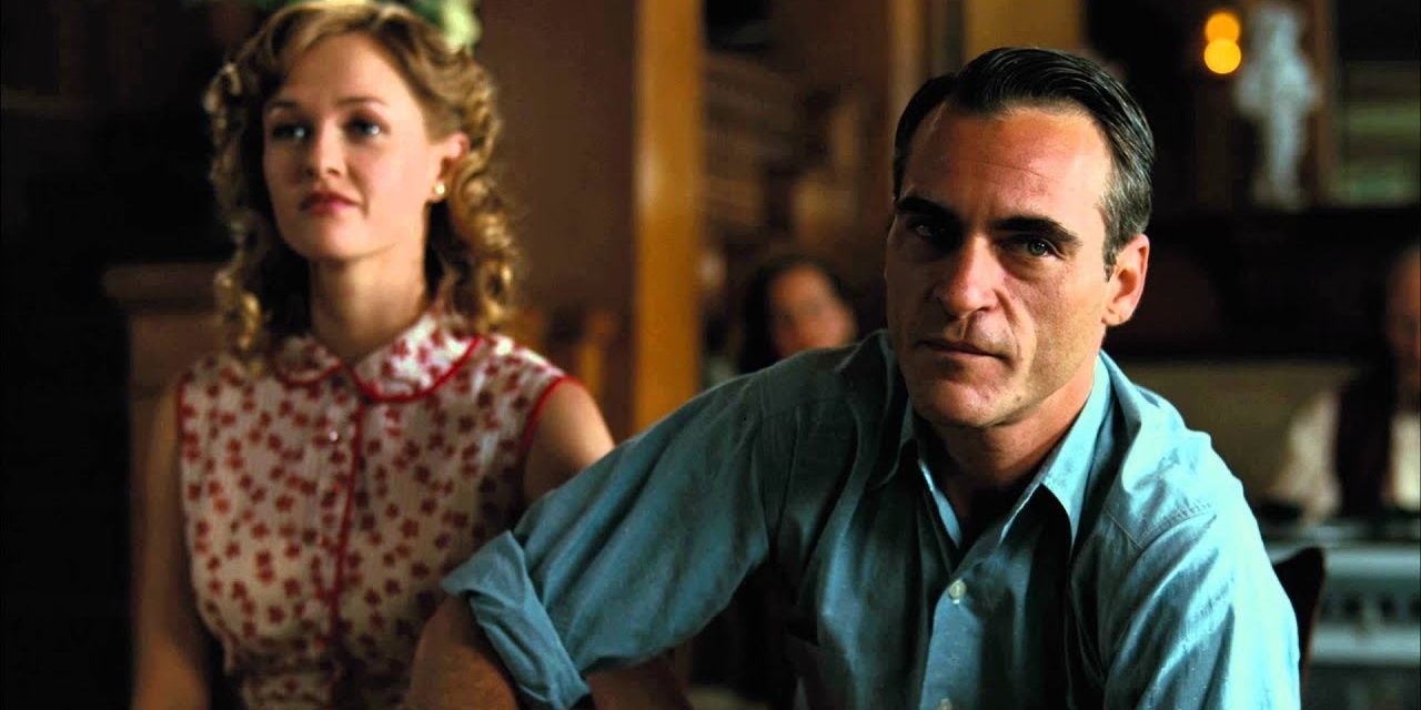 Joaquin Phoenix sits down with his sleeves rolled up.