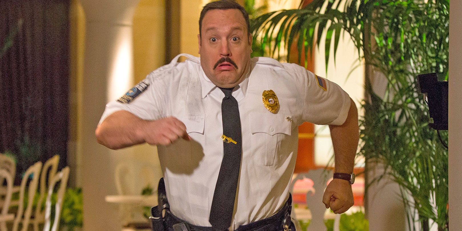 Paul Blart running in the Paul Blart Mall Cop movie.