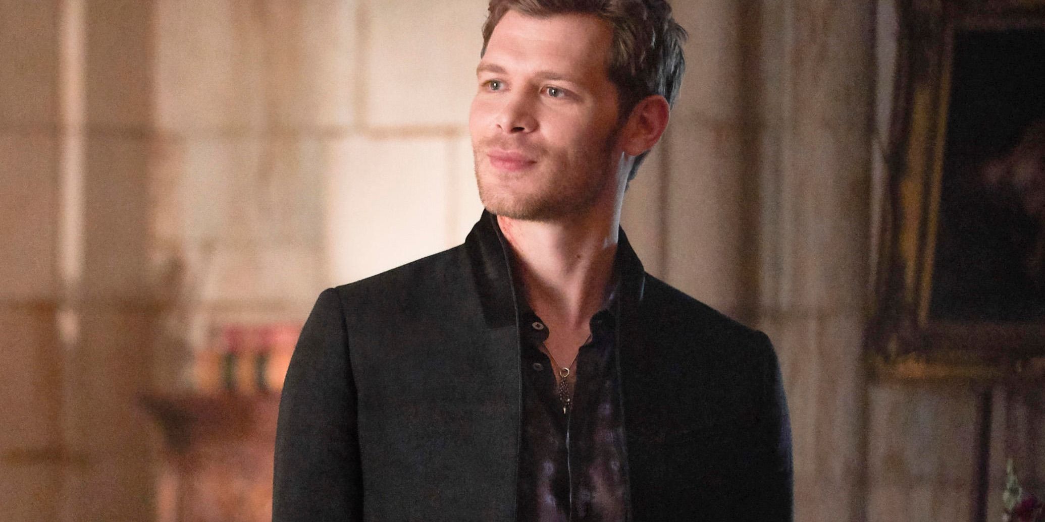Klaus Mikaelson wearing a suit and smiling in The Originals