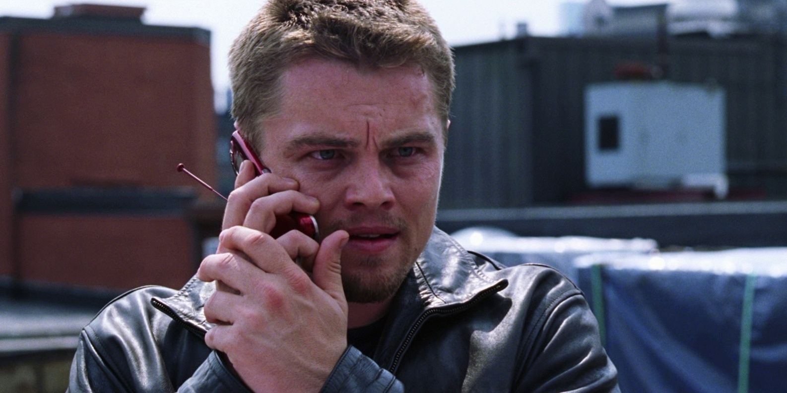 Billy on the phone on a roof in The Departed