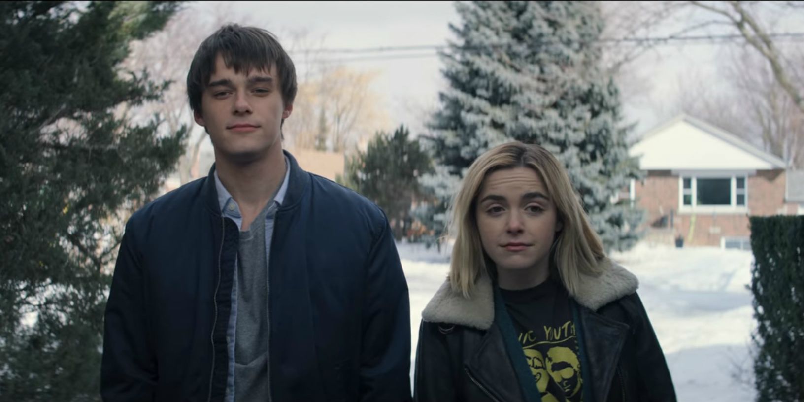 Mitchell Hope and Kiernan Shipka walking in the snow in Let It Snow