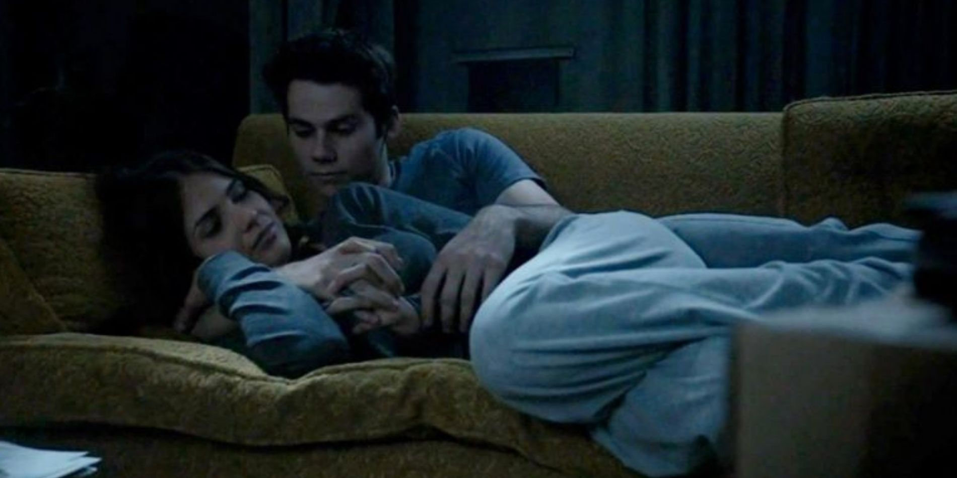Malia and Stiles curled up on the couch in Eichen House in Teen Wolf